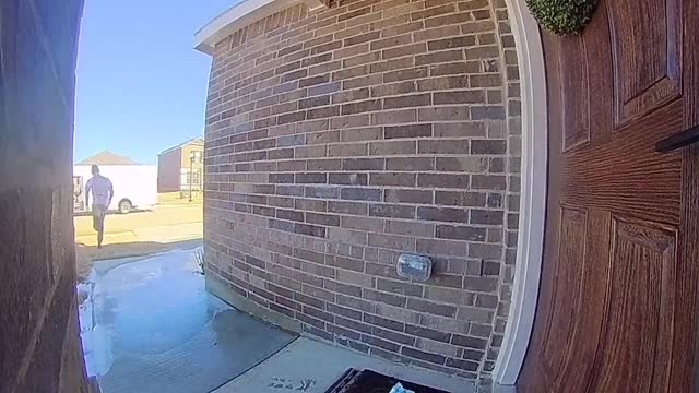 FedEx Delivery Guy Slides Across Ice Delivering Package in Style