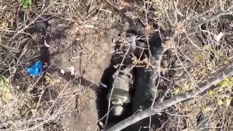 War Ukraine - Russia. They drop a grenade from a drone right into the trench