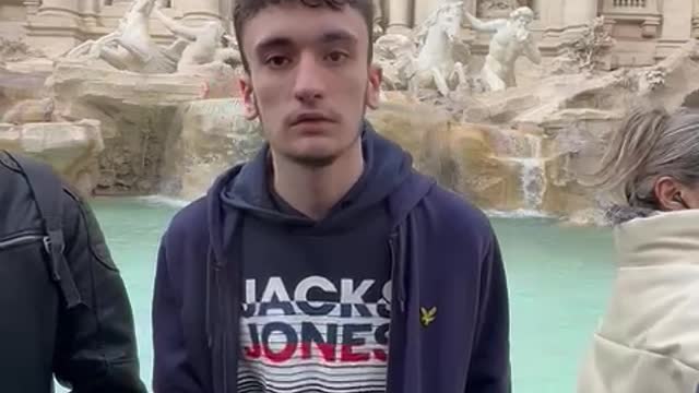 Guy Loses Balance Tossing Coin into Fountain