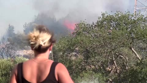 Hundreds fight raging wildfire burning towards Greek capital