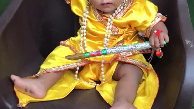 Indian child copy god krishna style