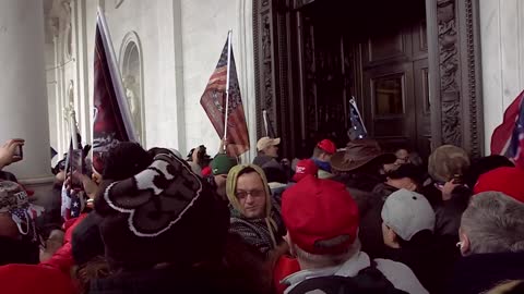 Crowd parts in front of Columbus Doors