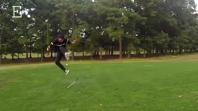 A man tried to hit a balloon with a golf ball