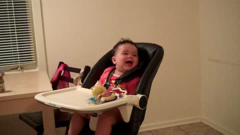 Baby laughs when mom jumps out from behind the fridge