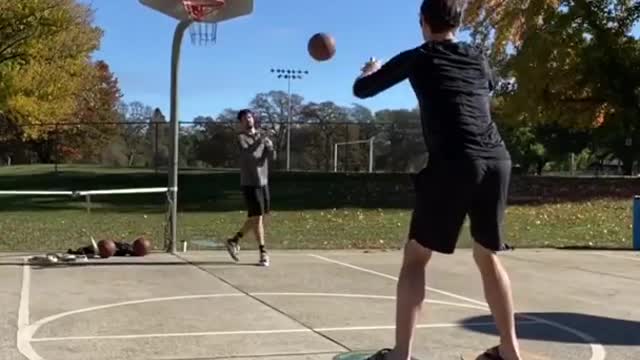 Man Scores Perfect Baskets While Balancing on Indo Boards