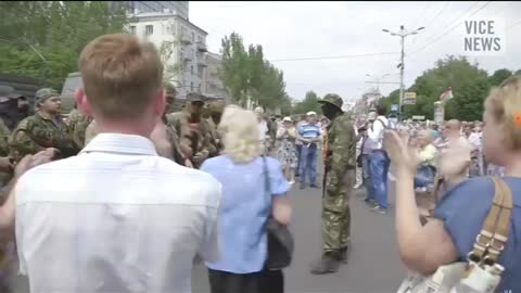 2014, Ukraine. Russian soldiers arrive in Donetsk - and are welcome