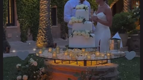 Couples Cutting Thier Wedding Cake