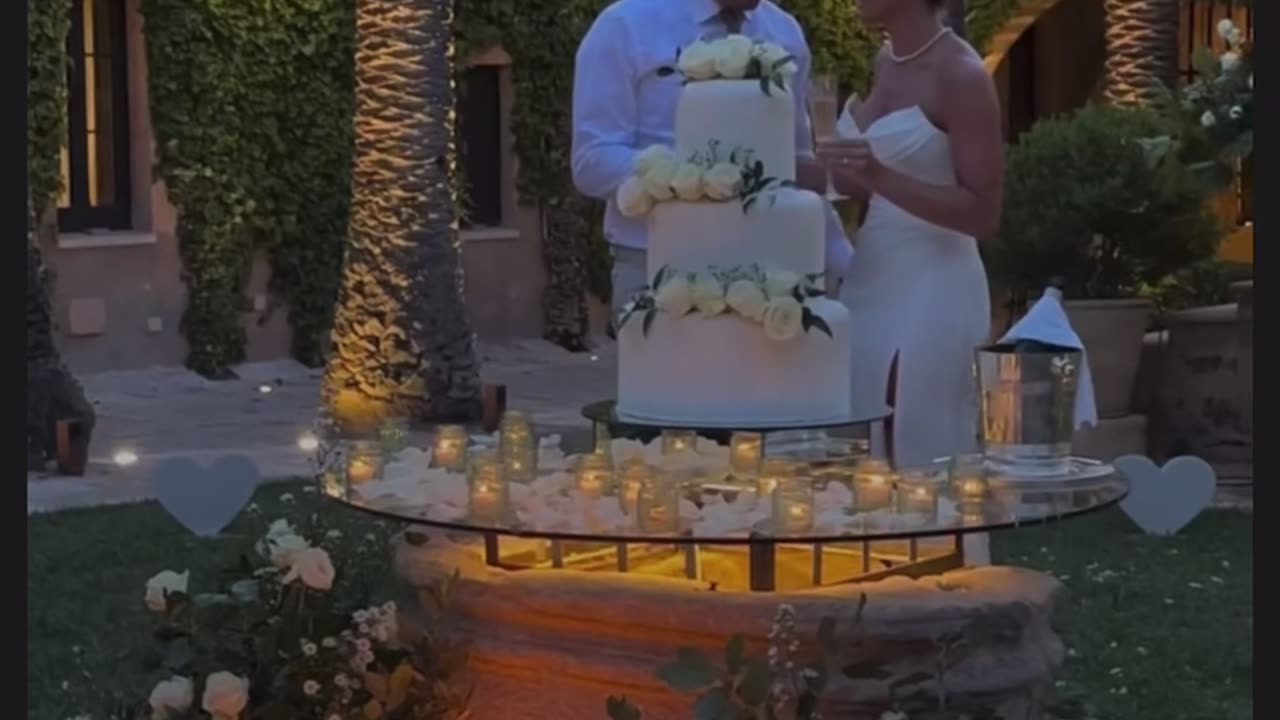 Couples Cutting Thier Wedding Cake