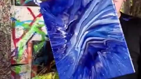 Guy Splatters Paint Into His Mouth And Clothes After Spinning Canvas