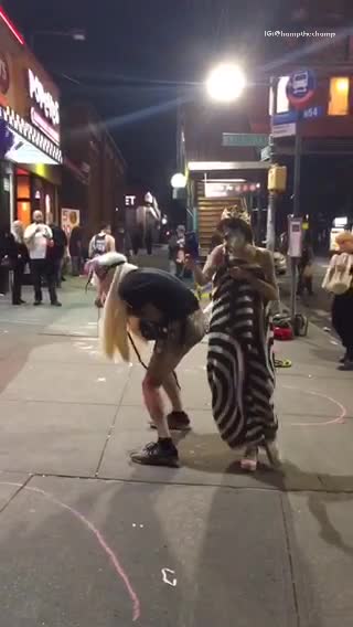 Man in gas mask dress holding blue phone case