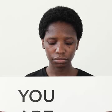 A Woman Holding a Placard