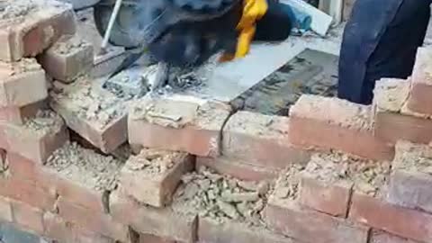 Worker Comically Demonstrates Demolition on Site