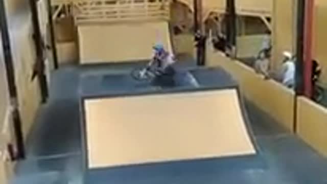 Yellow helmet bike indoor skate flip