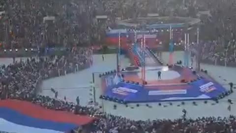 Putin appears at Moscow stadium, praises troops in Ukraine. Crowd chants: "Russia, Russia."