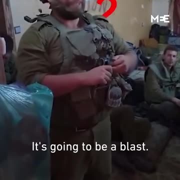 An Israeli soldier announces his wedding date while blowing up a house in Gaza.