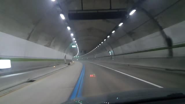 Lonely drive in highway tunnel