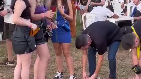 Guy tie his shoelaces & giving gifts like rose with letter