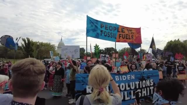 Youth climate protestors take over an intersection by the Capitol building