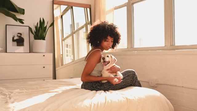 Young beautiful girl loving her dog