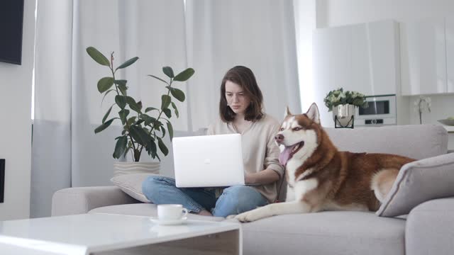 Woman and dog on a couch