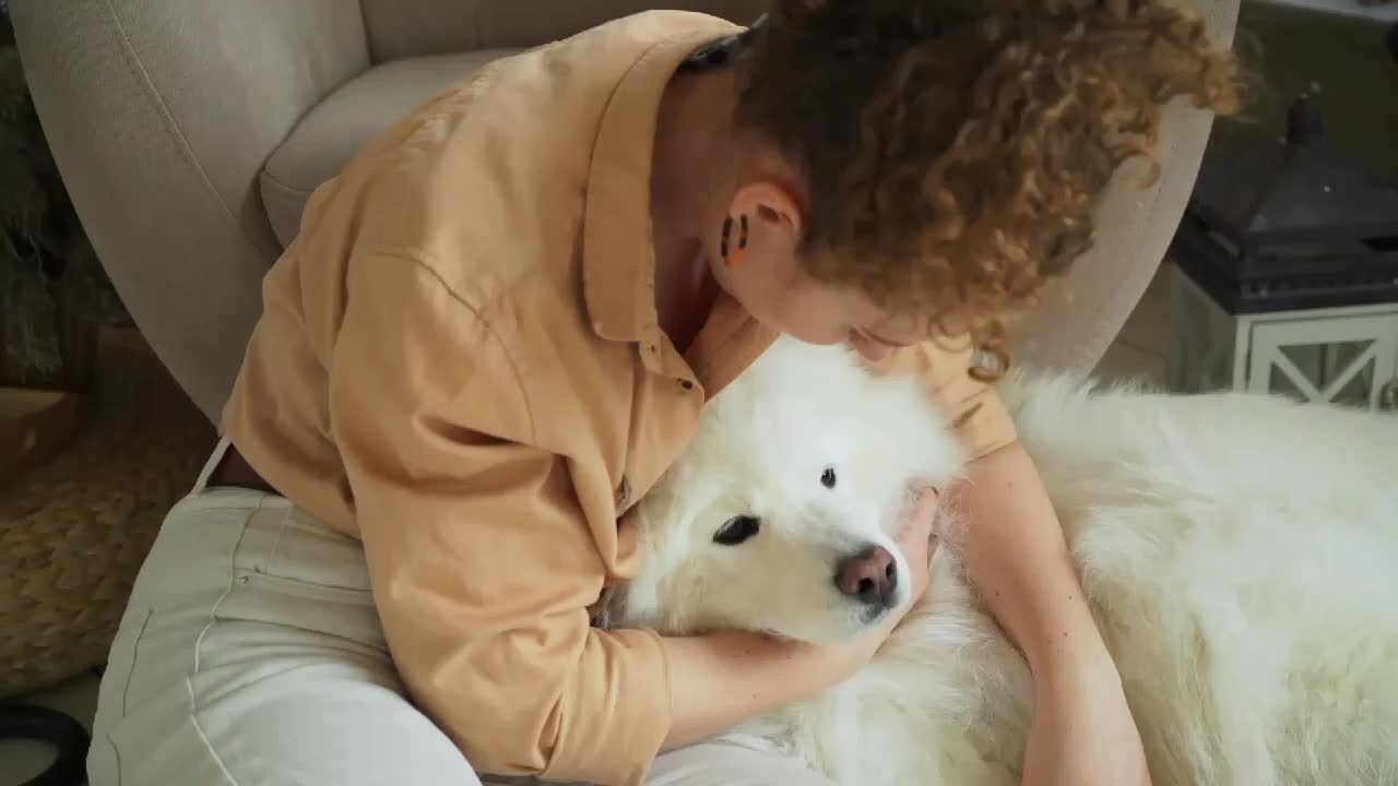 young Beautiful girl loving her dog