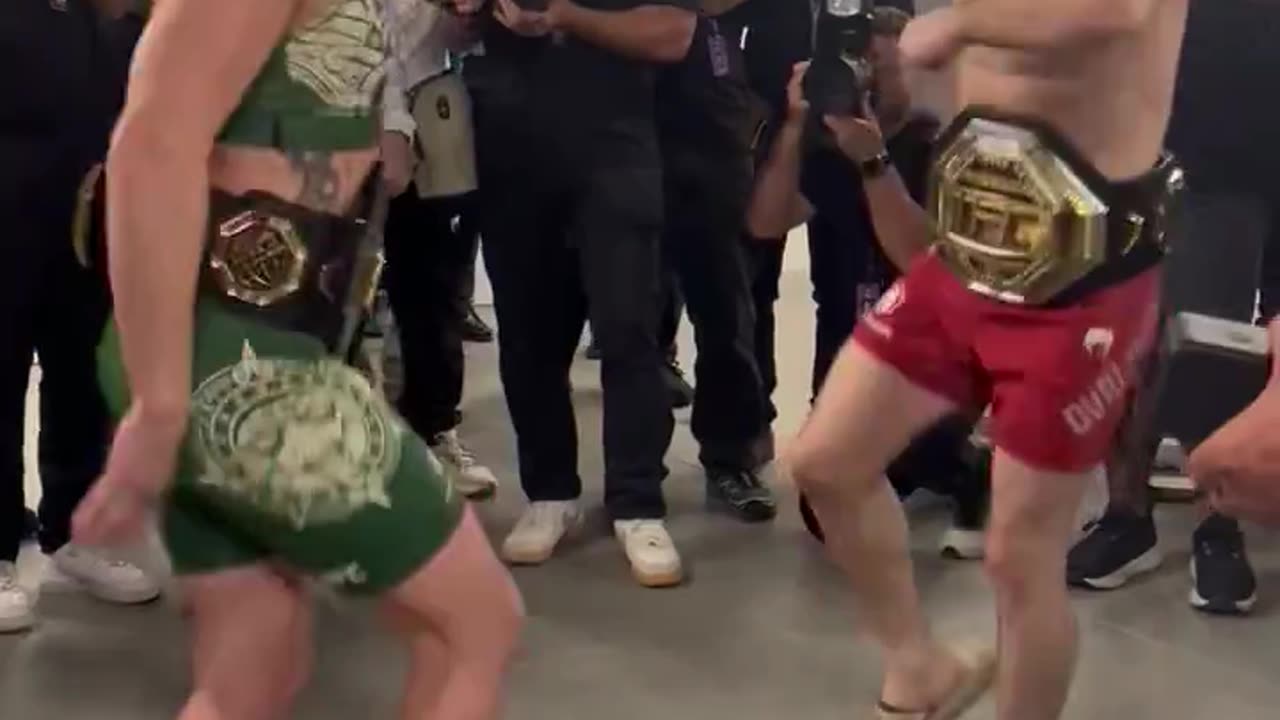 Merab Dvalishvili and Valentina Shevchenko dancing together after their title wins at UFC 306