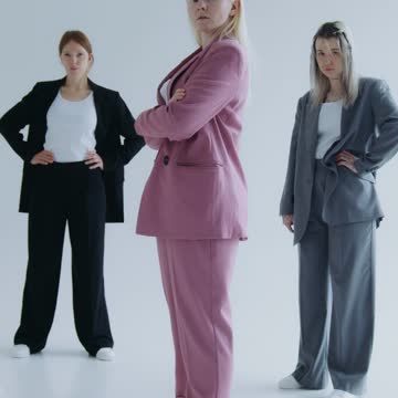 Women Wearing Business Suits and Posing