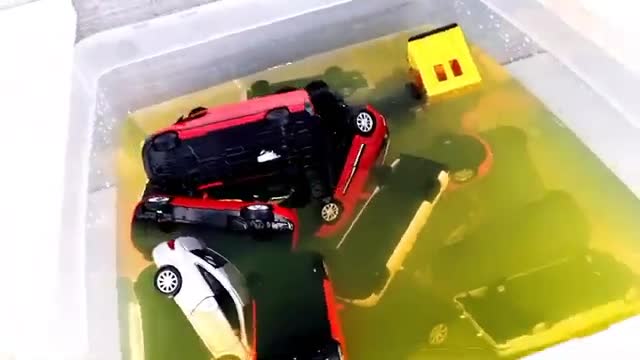 various cars moving and falling into the water - model cars