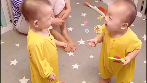 Cute twins having a nice conversation.