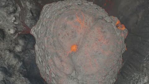 Drone footage shows huge blocks of red, hot lava rolling down