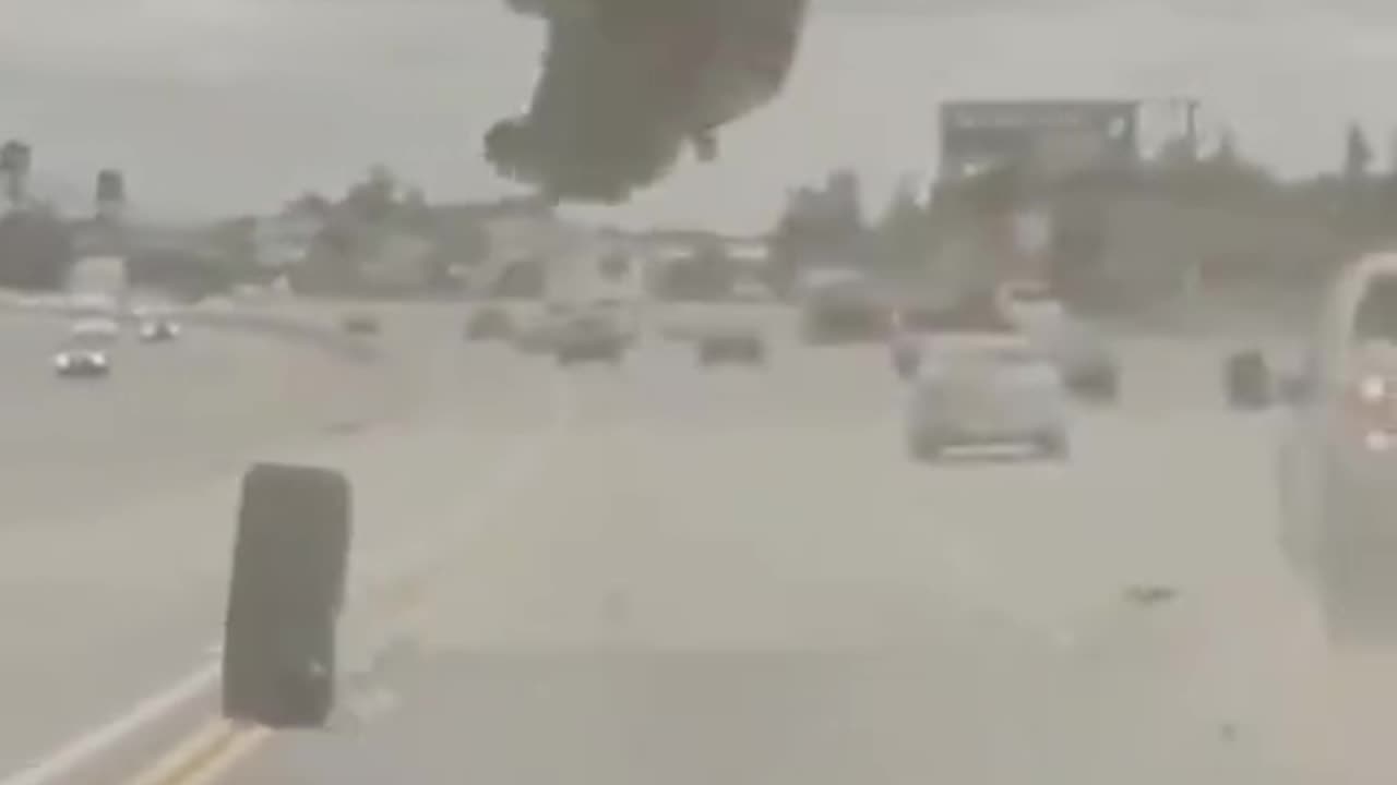 Car Flipped By a Loose Tire - They Survived