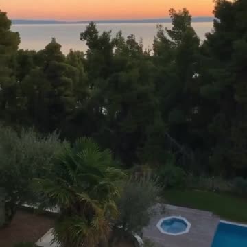 Calming balcony view over the forest and the sea