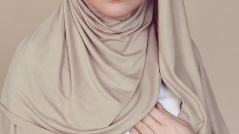 A muslim girl making makeup, what a beauiful face!