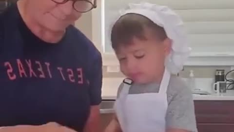 Little boy helping his mother