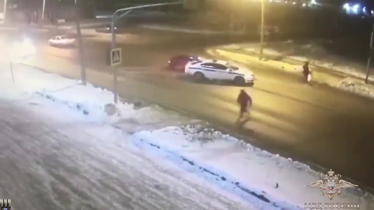 Police car saves 2 people from getting hit by speeding car.