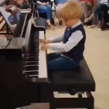 Child prodigy plays Mozart.