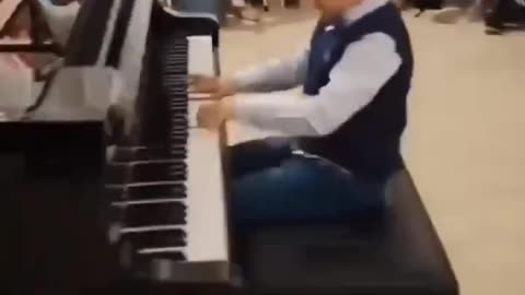 Child prodigy plays Mozart.