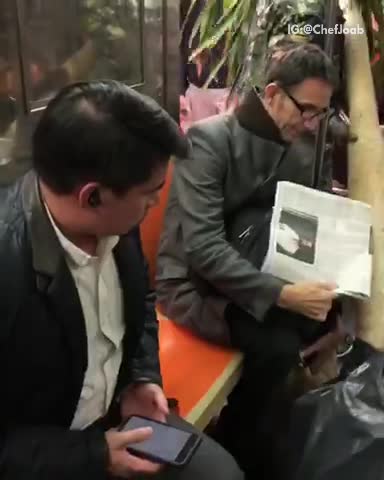 Guy camo trying to drag palm tree out of subway train