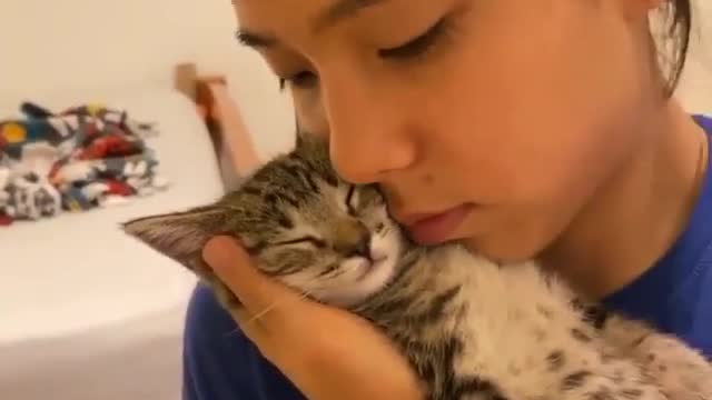 A girl kiss to a cute cat so lovely this video