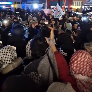 Islamic mobs and Antifa in Berlin surround German police and throw red paint
