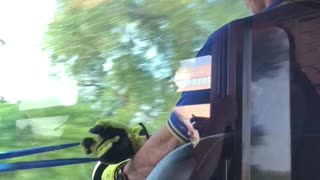 Train conductor driver working out blue resistance band