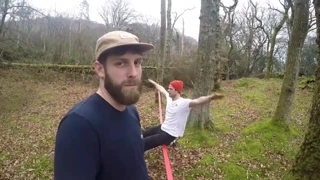 Collab copyright protection - man looks at camera slackline fall