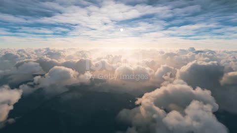 View of clouds over the mountains from above stock