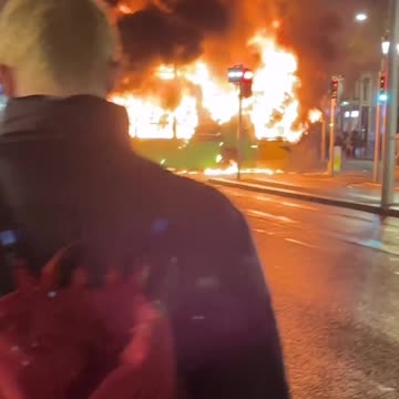 Chaos in Dublin.. Protesters are looting and they burned Bus..