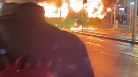 Chaos in Dublin.. Protesters are looting and they burned Bus..