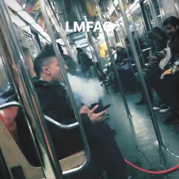 Guy brings hookah bong on subway train and smokes out of it