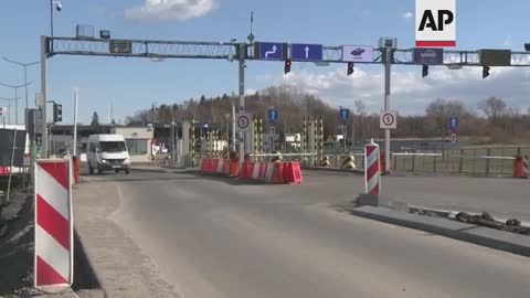 Ukrainians across border in Poland remain defiant