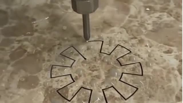 Water jet cutting through stone