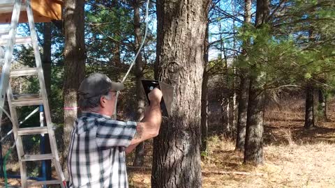 Installing brackets on a 100% cedar treehouse.