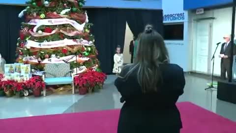 FLOTUS speaks at a children's national christmas celebration.